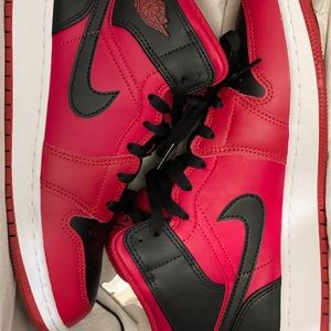 Air Jordan 1 mid tops.